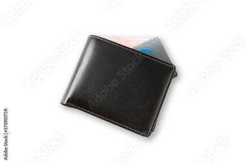 Top view of closed black genuine leather wallet with banknote and credit card inside on isolated white background with clipping path.
