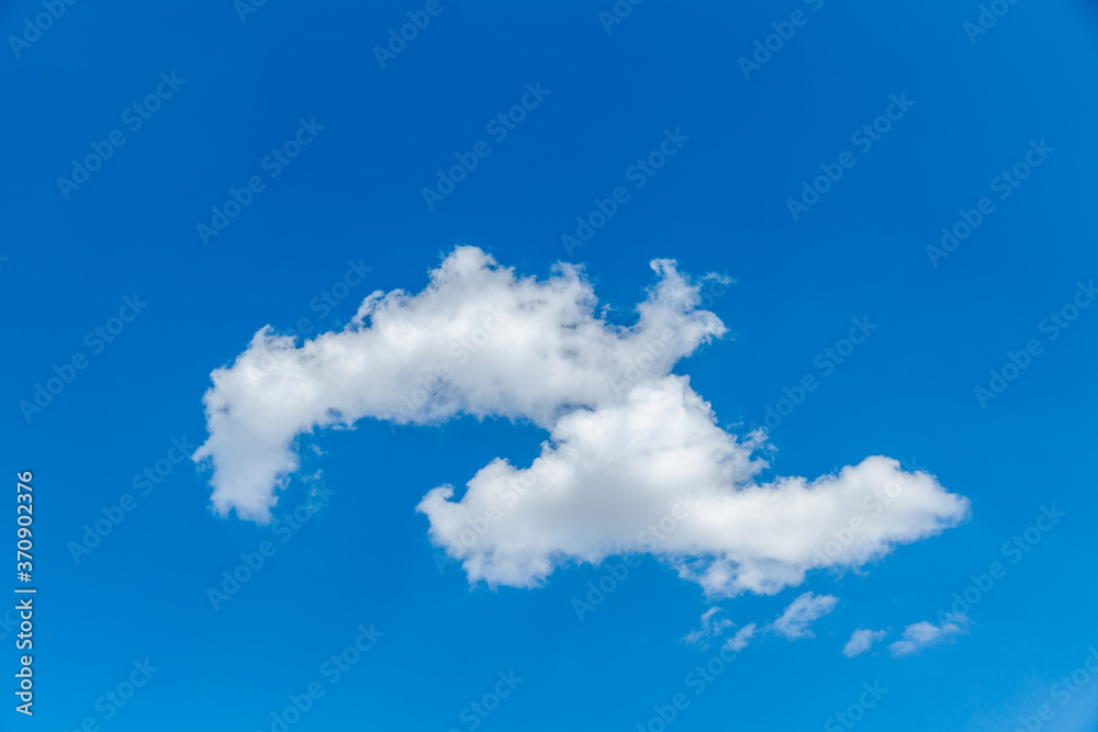 Single white cloud on clear blue sky background. Natural background Single white cloud on clear blue sky background. Natural background