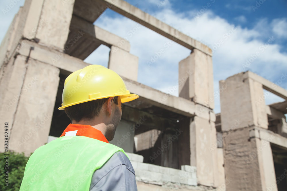 Construction worker with helmet in outdoors. Construction worker with helmet in outdoors.