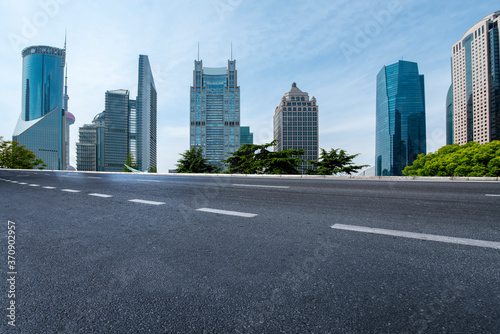 city road through modern buildings in China © 昊 周