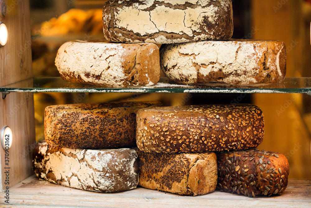 Tasty mixed variety of bread in bakery shopfront, artisanal bakery Tasty mixed variety of bread in bakery shopfront, artisanal bakery