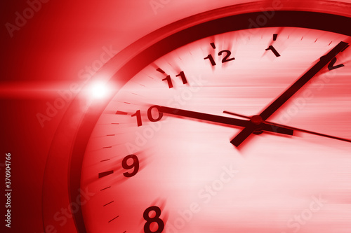 Fast speed dangerous times clock virus crisis hours concept, red color tone. photo