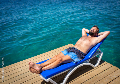 Man enjoying on summer beach vacation