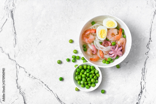 Wallpaper Mural A traditional dish of Asian cuisine. Rice vermicelli with shrimps, bebe octopus and green peas Torontodigital.ca