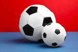 Soccer balls on color background