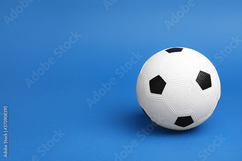 Soccer ball on color background