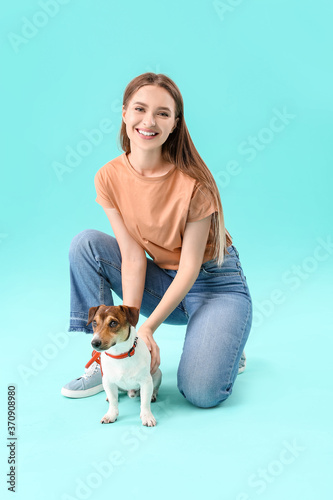 Young woman with cute dog o...