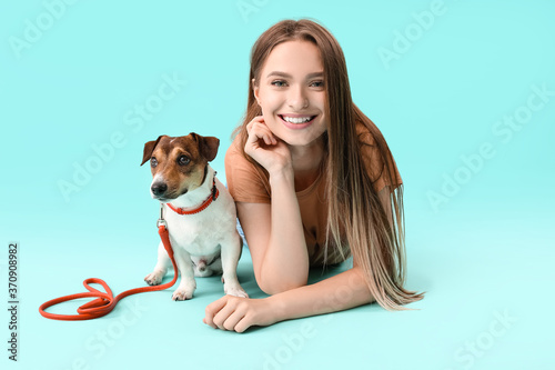 Young woman with cute dog o...