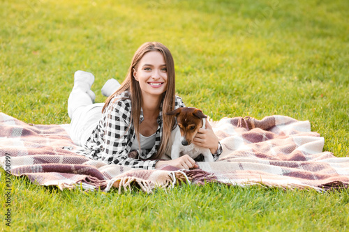 Young woman with cute dog r...