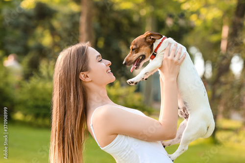 Young woman with cute dog w...