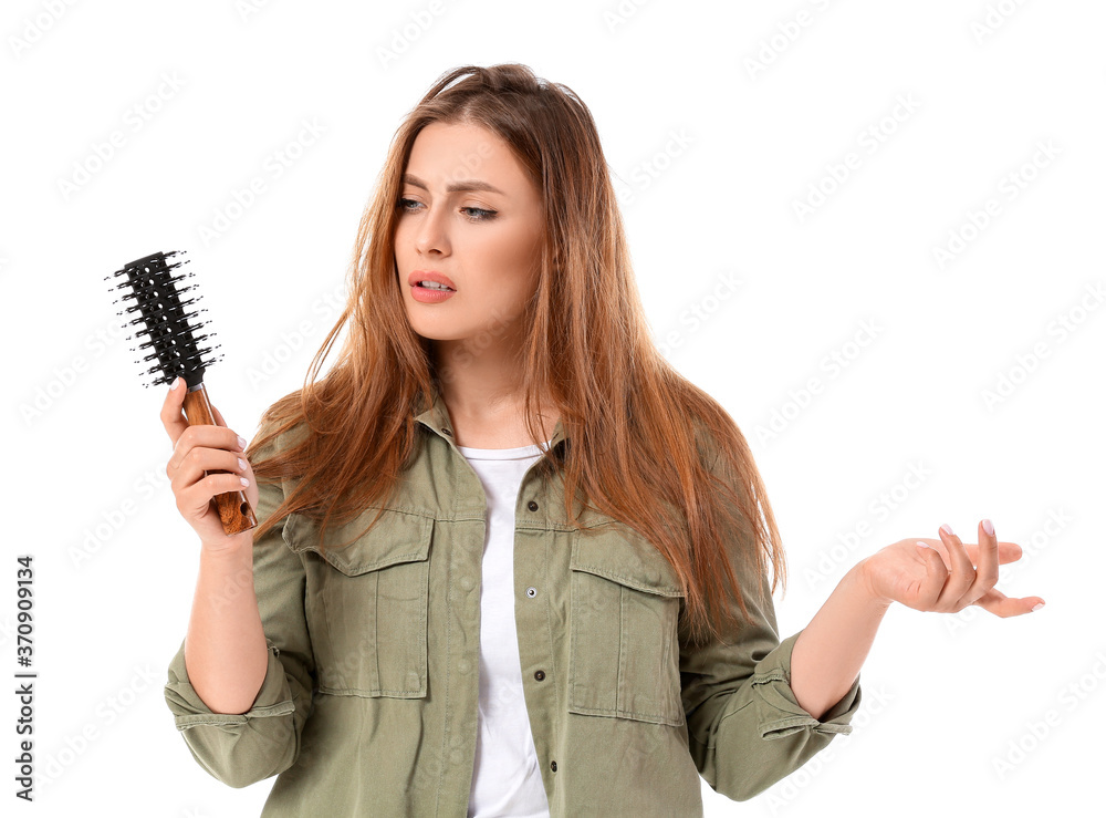 Stressed woman brushing hair on white background Stressed woman brushing hair on white background