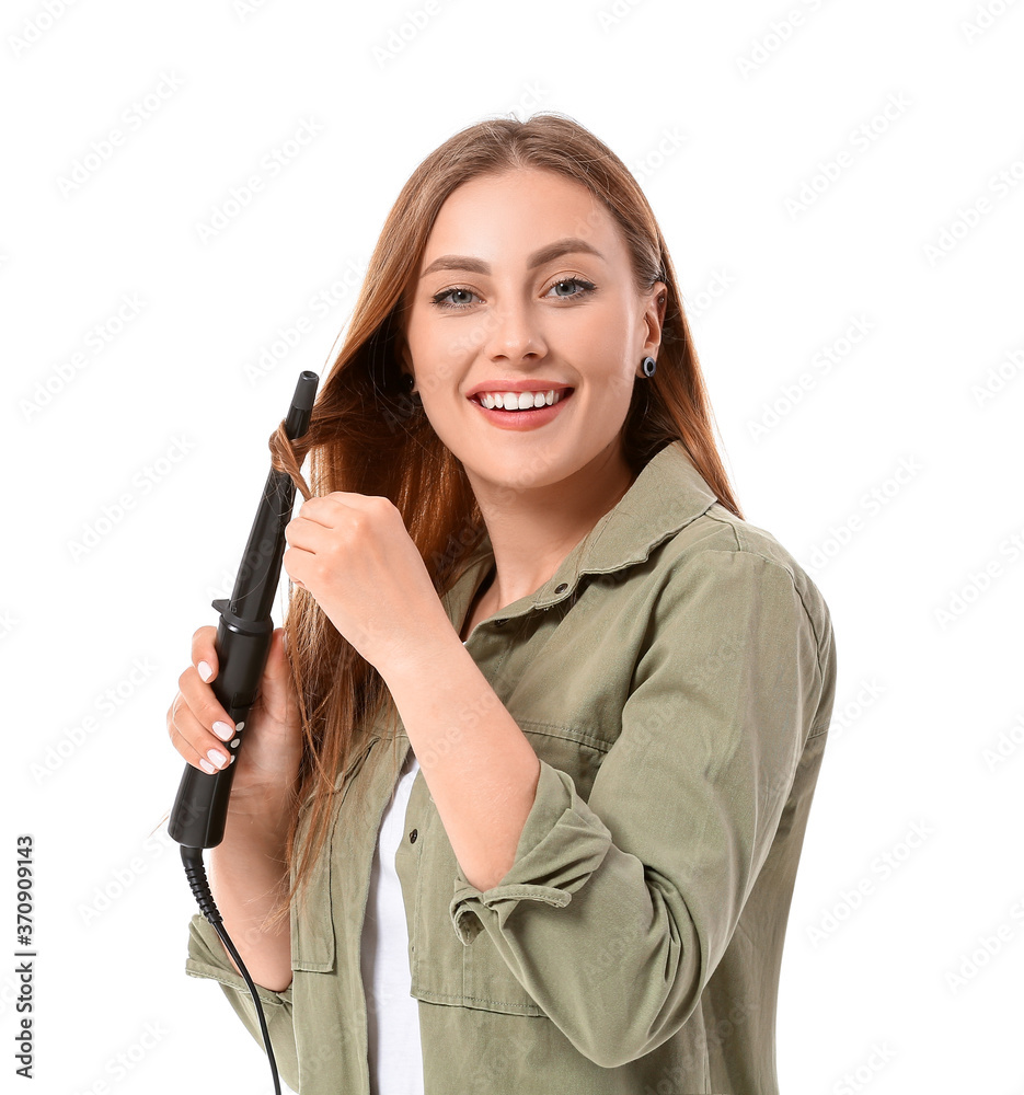 Young woman with curling iron on white background Young woman with curling iron on white background