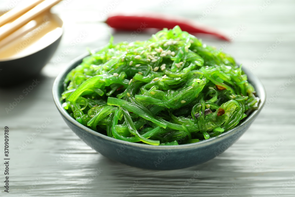Plate with tasty seaweed salad on table Plate with tasty seaweed salad on table