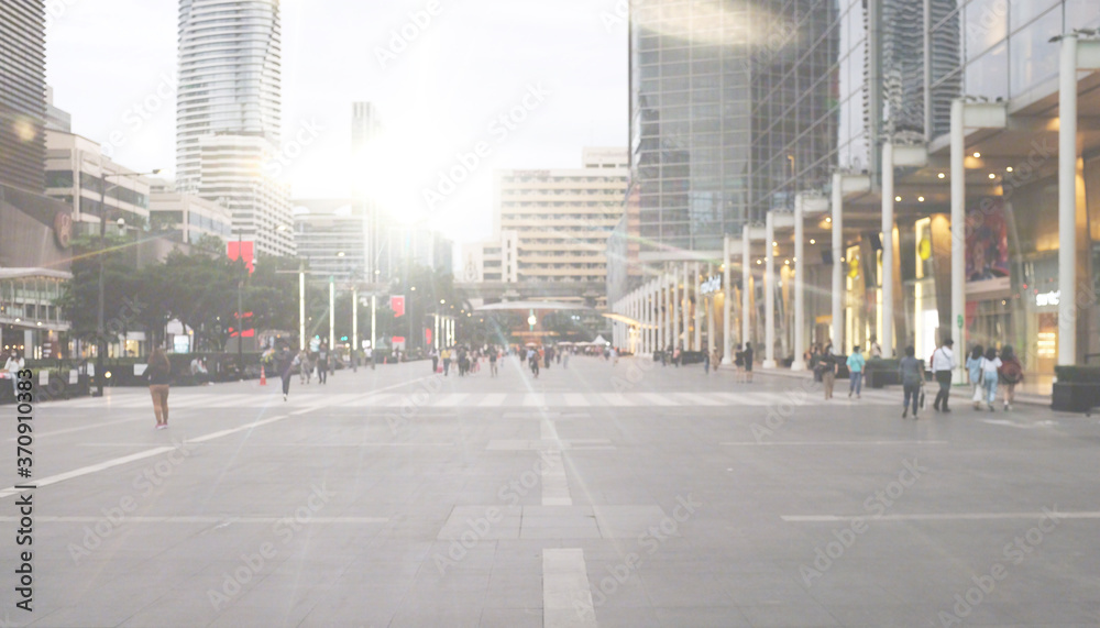 Naklejka premium The light trails on the modern building background in cityscape.