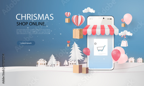 paper art shopping online on smart phone chrismas day and new year winter season  chrismas day
