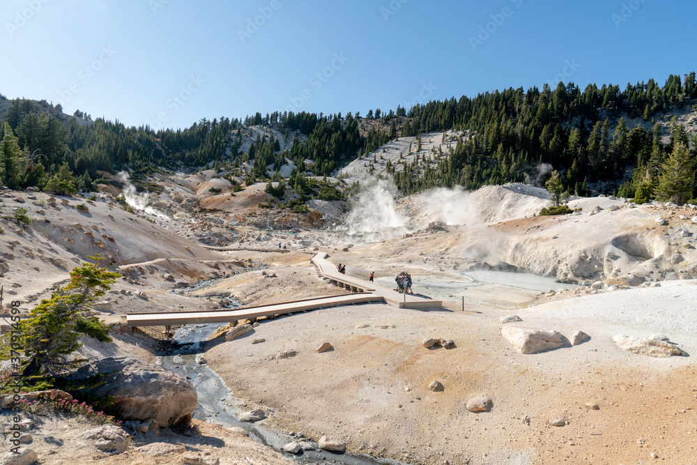 Lassen Volcanic National Park. Rocky trail with grand vistas descends to a boardwalk through Lassen's largest hydrothermal area. Trailhead at Bumpass Hell Parking area. Lassen Volcanic National Park. Rocky trail with grand vistas descends to a boardwalk through Lassen's largest hydrothermal area. Trailhead at Bumpass Hell Parking area.