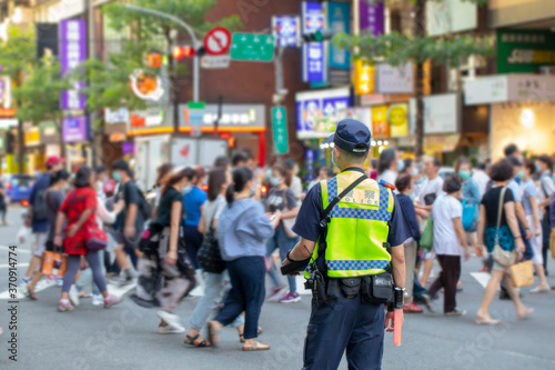 The police patrolling at the crossroads to guard the safety of the people