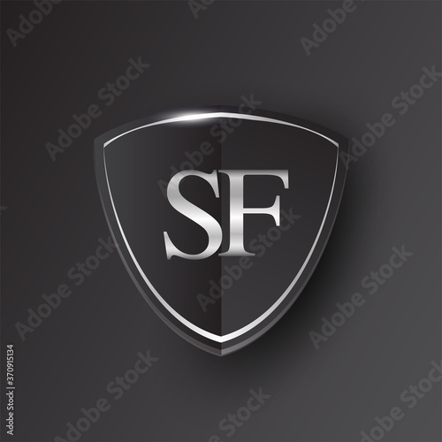 Initial logo letter SF with shield Icon silver color isolated on black background, logotype design for company identity.
