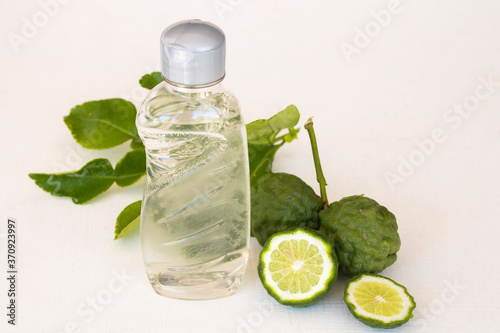 cleanser liquid washing extract from herbal kaffir lime for cleaning bottle milk health care of baby on background white 