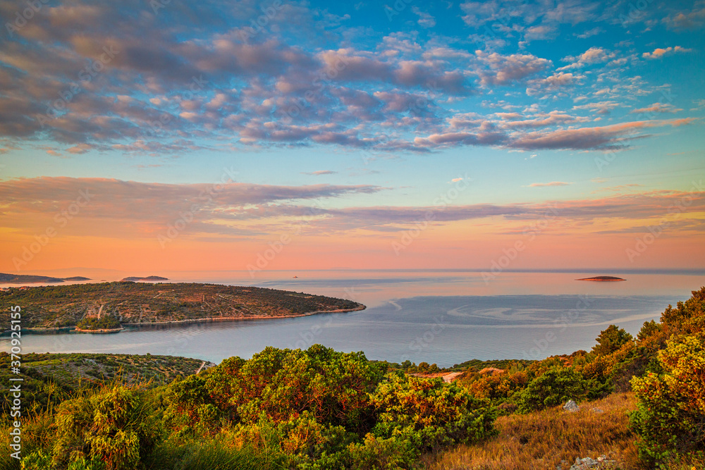 Panoramic view of Adriatic coast near The Primosten town at the colorful dawn of the day, Croatia, Europe.