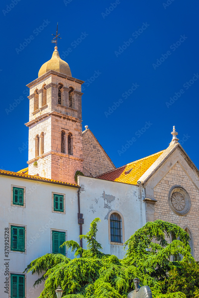Franciscan monastery with the bell tower in Sibenik. A historic town on the Dalmatian coast of Adriatic sea in Croatia, Europe.