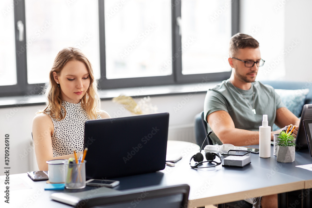 business, people and corporate concept - team of startuppers or ui designers working at office business, people and corporate concept - team of startuppers or ui designers working at office