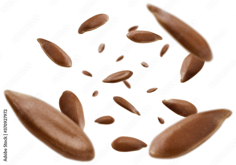 Flax seeds are levitated on a white background Flax seeds are levitated on a white background