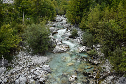 Obraz na płótnie scenic mountainous landscape with stony river with clear blue waters in Valbone nature park w salonie