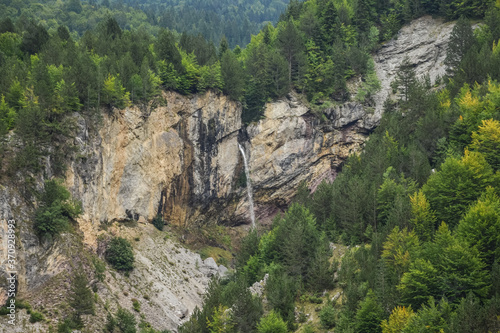 Obraz na płótnie scenic mountainous landscape with vertical waterfall in Valbone nature park w salonie