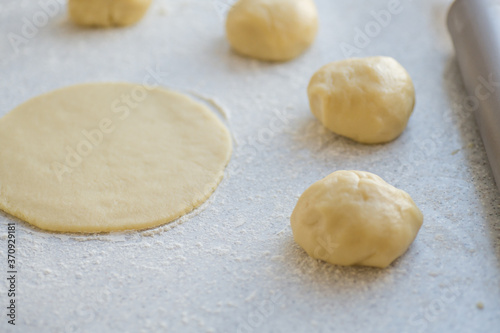 Step-by-step instructions for making bagel cookies for use in recipe illustrations. Balls of dough, blanks. step 2