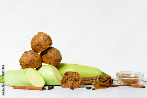 chocolate muffins with zucchini and banana. wet veggie cupcakes home-made, top view on a light background. cooking muffins in the kitchen . in the split view