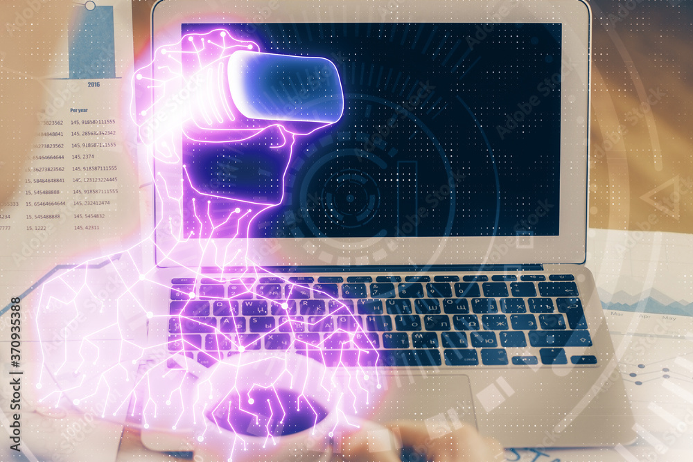 Computer on desktop with AR theme icon. Multi exposure. Concept of augmented reality. Computer on desktop with AR theme icon. Multi exposure. Concept of augmented reality.