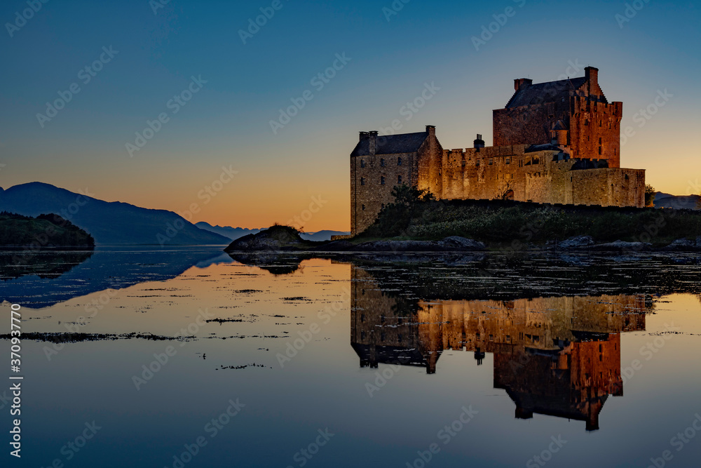 Beautiful sunset and Reflection at Eilean Donan Castle in Dornie, Highalnds, Scotland.