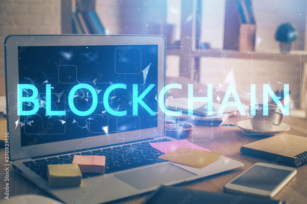 Multi exposure of blockchain theme hologram and table with computer background. Concept of bitcoin crypto currency. Multi exposure of blockchain theme hologram and table with computer background. Concept of bitcoin crypto currency.