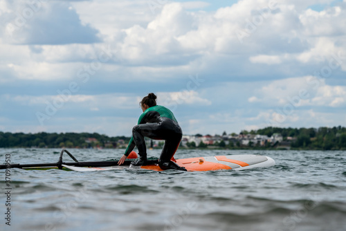 Woman participating in a windsurfing course