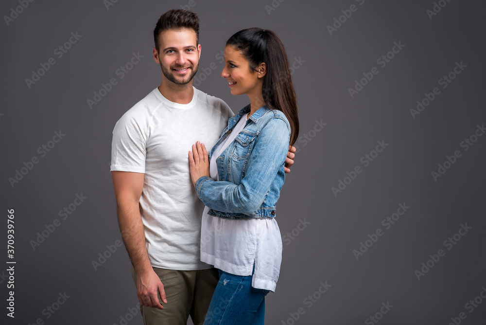 Fototapeta premium Nice young couple in the studio