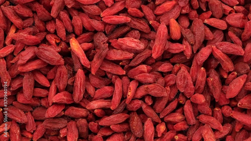super food dried goji berries rotating, top view super food dried goji berries rotating, top view