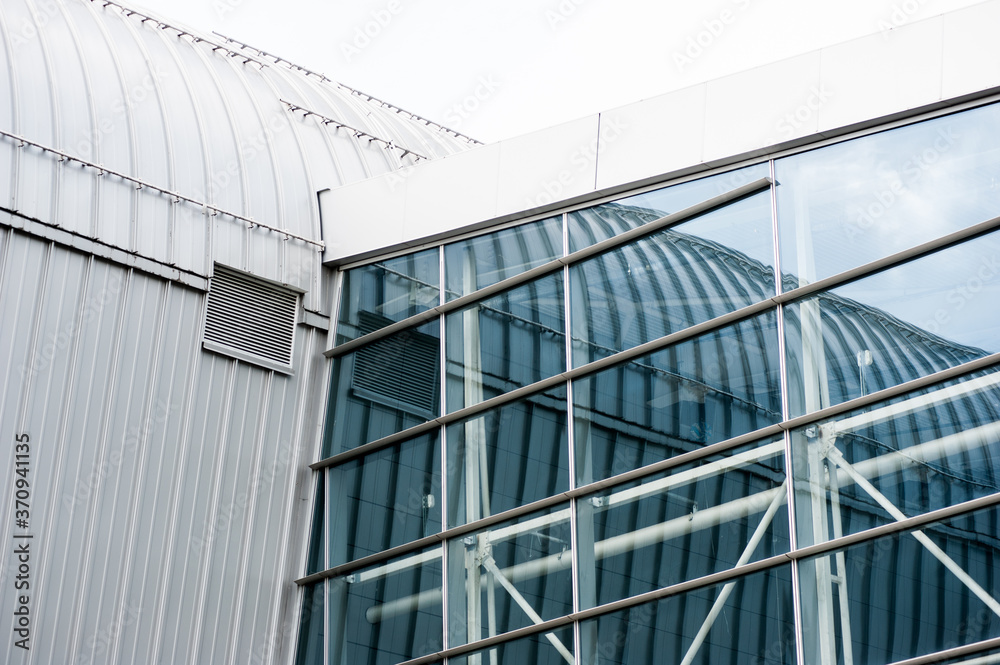 Modern glass facades of large buildings. Architecture elements Modern glass facades of large buildings. Architecture elements