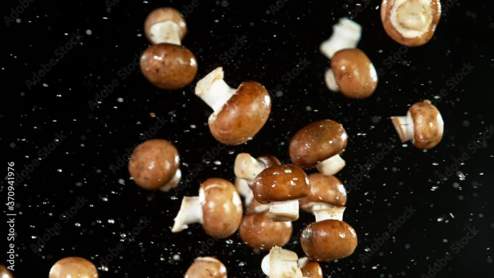 Super slow motion of champignons mushrooms flying up in the air. Filmed on high speed cinema camera, 1000 fps. Super slow motion of champignons mushrooms flying up in the air. Filmed on high speed cinema camera, 1000 fps.