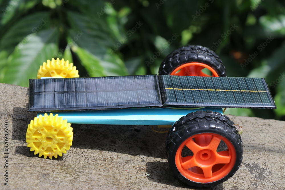 Fototapeta premium Small solar car also called as mini solar powered car which is powered by solar cell,which drives dc motor connected to wheels