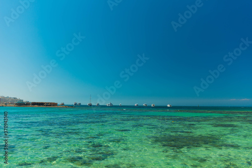 transparent wavy red sea water surface with horizon on background