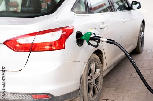 Refueling the car with gasoline at a gas station