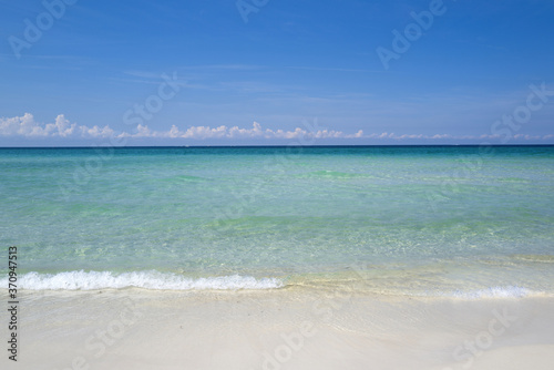 Soft blue ocean wave on clean sandy beach. © Volodymyr