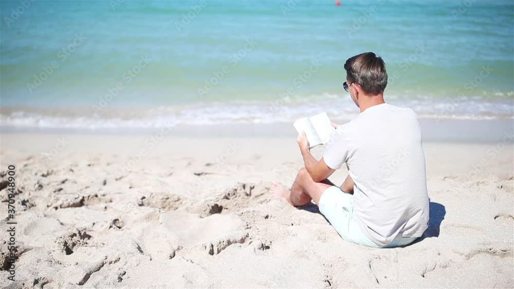 Young man on the white beach on vacation Young man on the white beach on vacation