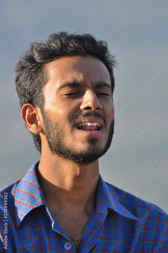 Fototapeta premium Young Indian Man Singing Song 