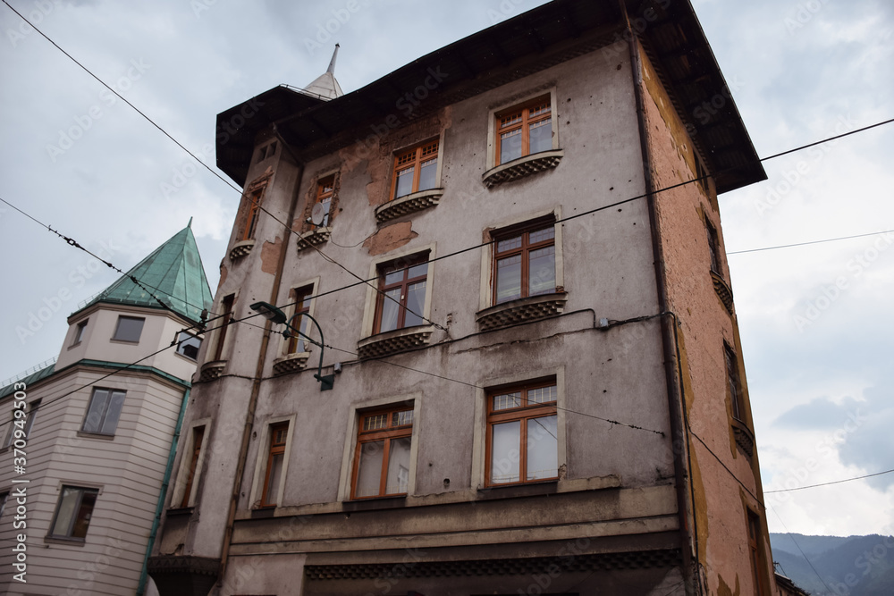 buildings damaged with shrapnel during the war in Sarajevo