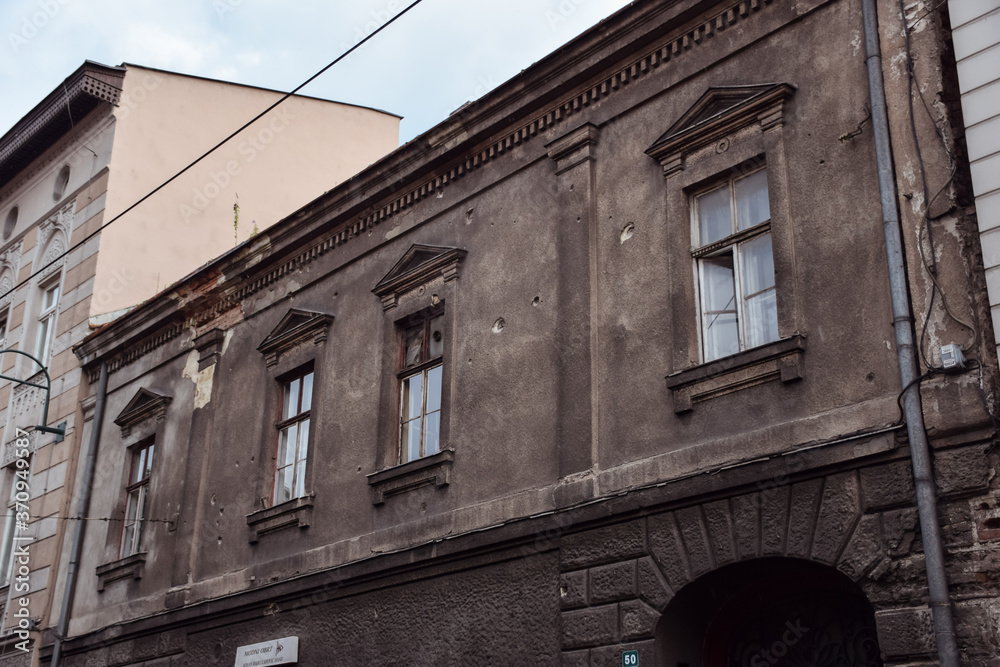buildings damaged with shrapnel during the war in Sarajevo