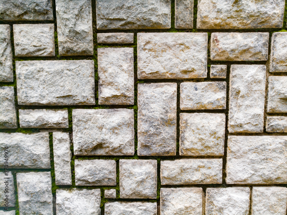 Fototapeta premium Rock texture background on a wall which have cuts on it.