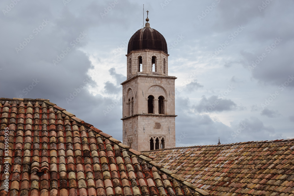 church tower and clay tile roofs against the sky