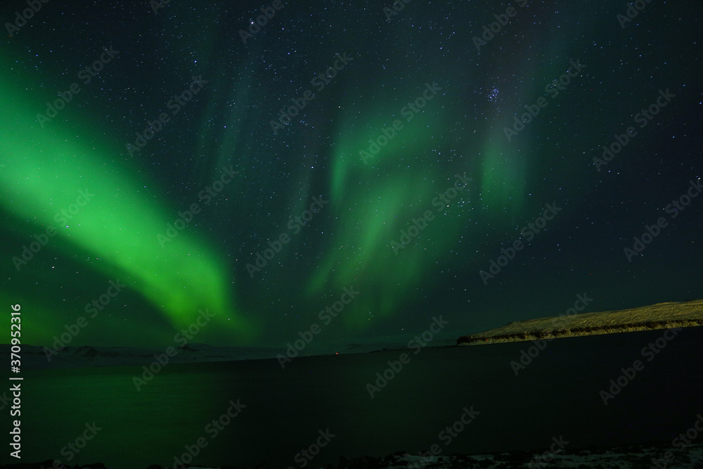 Northern Lights over the sea in Iceland.
